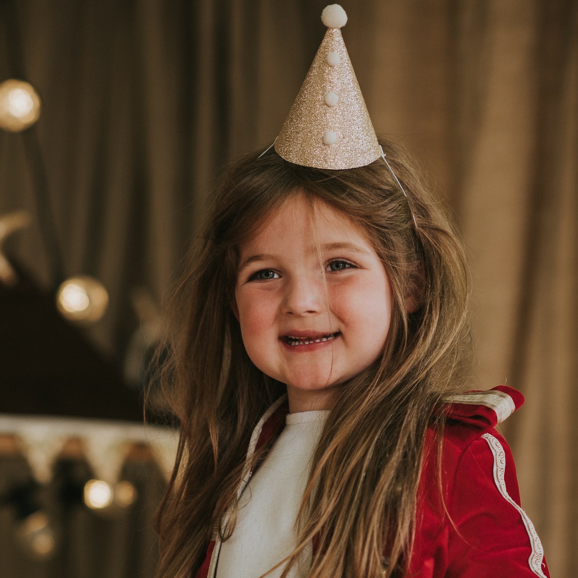 6 year-old child wearing a Fable Heart Gold Pierrot Party Hat £6